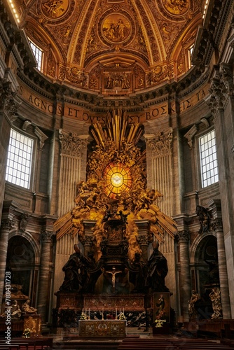 A religious institute showcasing medieval architecture with a dome, stained glass windows, and a statue of Jesus on the altar. The buildings symmetry and facade make it one of the holy places photo