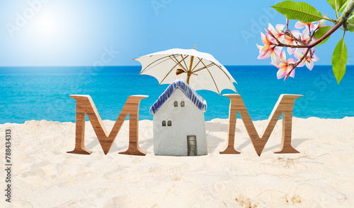 Mother's day card background idea, mom wooden font on tropical beach, summer outdoor day light