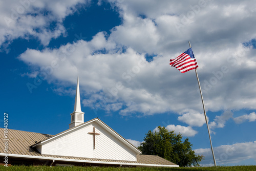 an american flag in front of a church