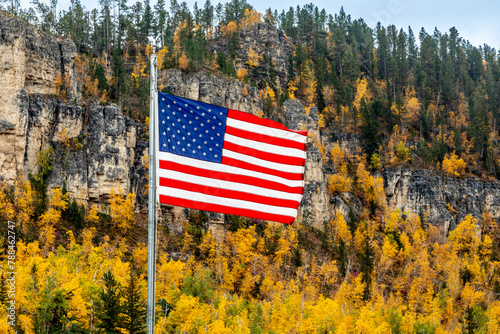 US Flag Flying against the Fall Colors