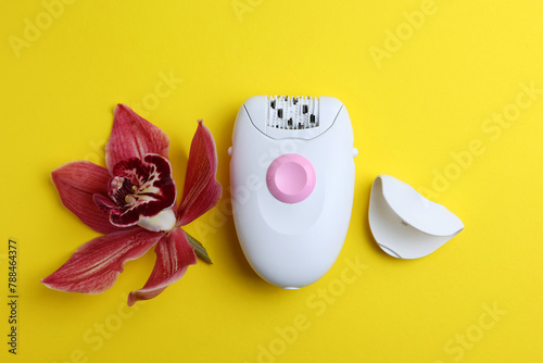 modern epilator for removing unwanted body hair on a bright background. Home hair removal method