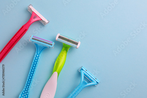 razors for removing unwanted body hair on a bright background. Home hair removal method