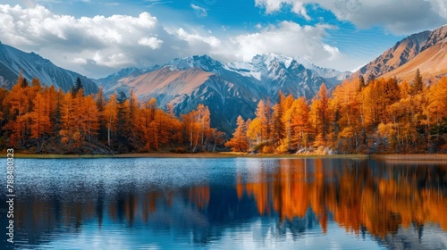 beautiful landscape of a large lake with mountains and orange trees in autumn in high resolution and high quality