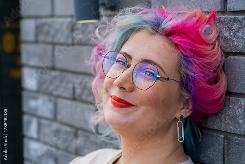 Close-up portrait of curly Caucasian woman with multi-colored hair. Model for hairstyles © Михаил Решетников