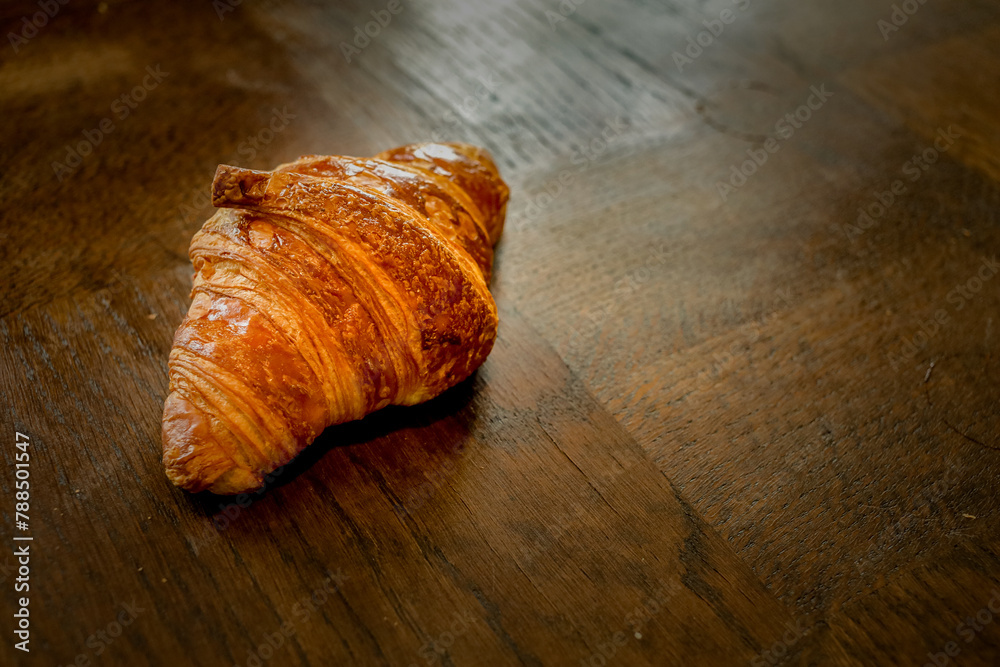 traditional french croissant on wooden table traditional french croissant on wooden table