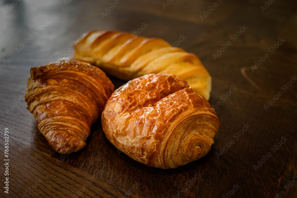 variety of french viennoiseries on wooden surface variety of french viennoiseries on wooden surface