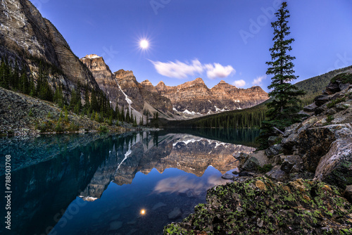 Alpine lake in mountains at early morning.  Moraine Lake in Banff National Park, Canadian Rockies, Alberta, Canada.