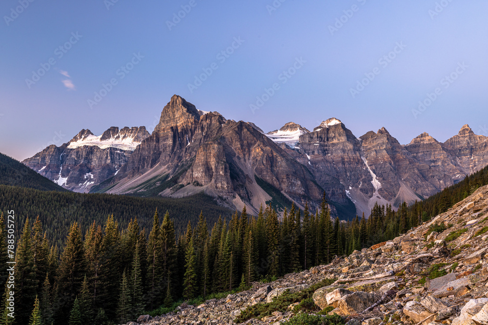 Epic panorama view at blue hour of scenic alpine landscape of The Valley of the 10 Peaks in the Rocky Mountains of Banff National Park, Alberta, Canada.