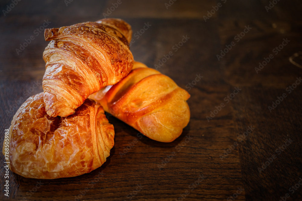 variety of french viennoiseries on wooden surface