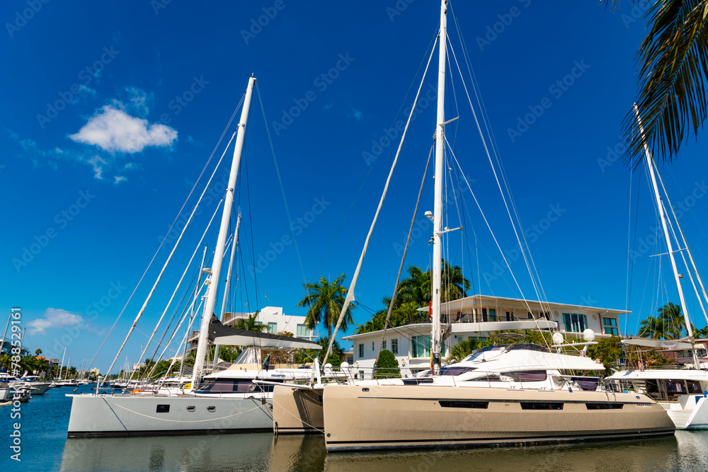 Fototapeta premium Sailing on sailboat. Modern villa with yacht. Dreamy summer vacation in villa. Luxury villa with yacht. Luxury summer vacation. Residential villa for relaxing summer vacation. Sailboat adventure