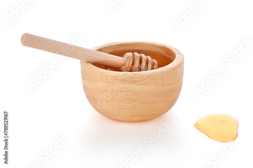 Honey in wooden bowl and honey Dipper isolated on white background.