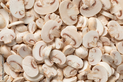 Fresh sliced champignons, Button mushrooms, close up full frame as background