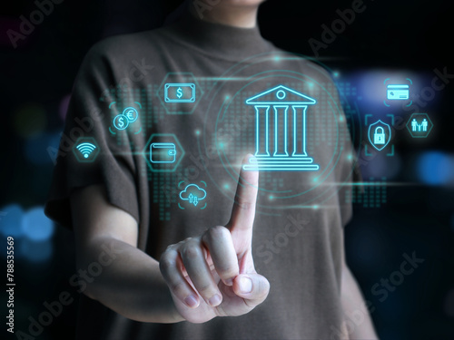 Virtual bank, digital banking, online payment, cyber security. Woman touching a virtual bank icon