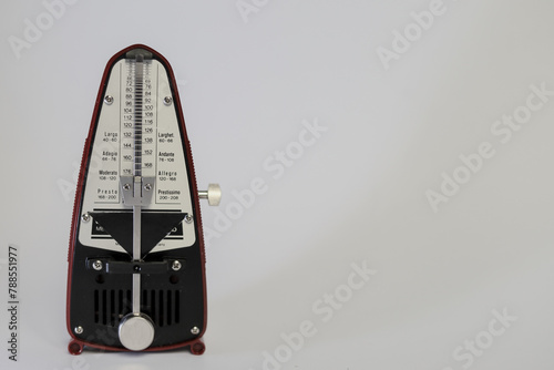 Fotografie a vintage metronome on white background