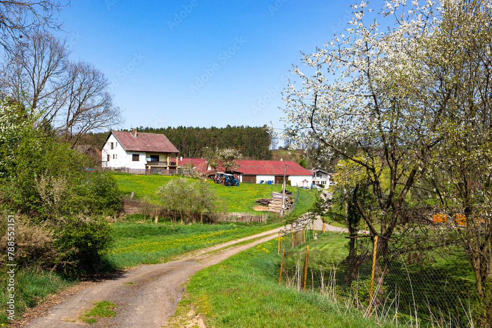 Scenic countryside with village during sunny spring day. Scenic countryside with village during sunny spring day.