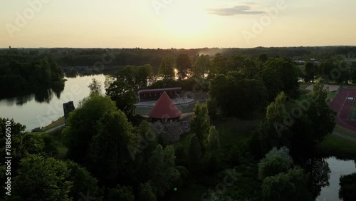 Aluksne town in summer. Aerial view from the drone in beautiful sunny weather. Medieval castle wall ruins of Livonian Order in Aluksnes pilssala, latvia, aerial (ID: 788560510)