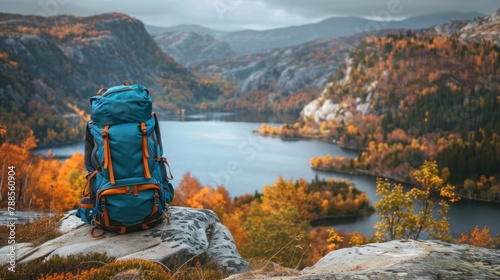 beautiful TRAVEL backpack ON A STONE and a beautiful landscape of a lake surrounded by mountains in autumn in high resolution and high quality. concept backpacks, resources, landscape