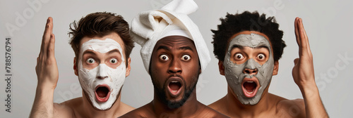 Surprised multicultural men with facial masks enjoying spa day - self care for every man