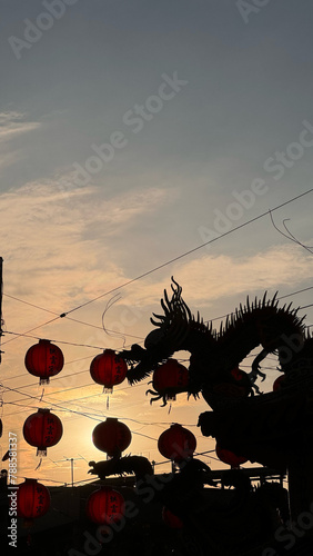 Dragon on the roof with lantern in mouth (ID: 788581337)