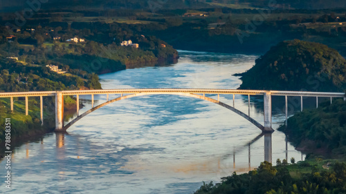 Border between Brazil and Paraguay and connects Foz do Iguaçu to Ciudad del Este. Ponte da Amizade in Foz do Iguaçu. Aerial view of the Friendship Bridge with Paraná river..