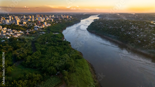 Border between Brazil and Paraguay and connects Foz do Iguaçu to Ciudad del Este. Ponte da Amizade in Foz do Iguaçu. Aerial view of the Friendship Bridge with Paraná river.. © marabelo