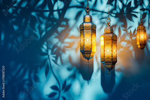 Islamic background with golden lanterns and shadows from moonlight for Eid greeting card with whitespace and blue theme. Eid and ramadan concept photo