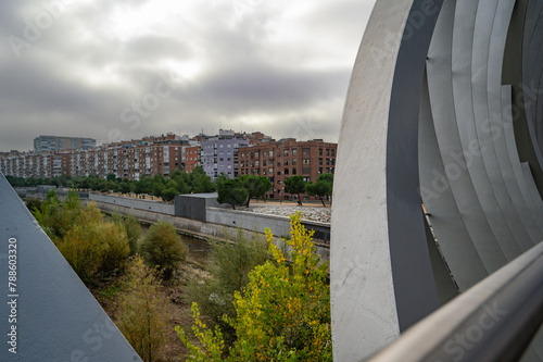 MADRID, SPAIN - November 17, 2023: Arganzuela Bridge in Madrid Rio Park, Designed by Dominique Perrault, it is 274 meters in length and formed by two spiral-shaped walkways . High quality photo photo