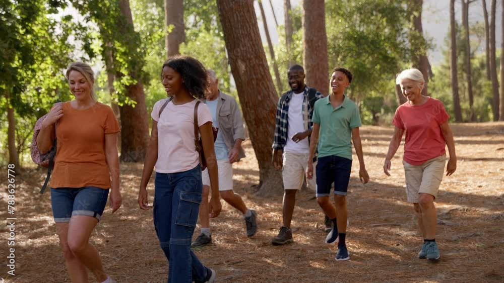 Active three generation family with teenage children on hike in countryside together- shot in slow motion Active three generation family with teenage children on hike in countryside together- shot in slow motion