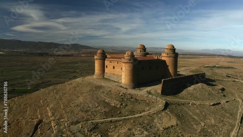 Aerial View of a Desert Castle, Ancient Fortress on a Desert Hilltop, Solitary Castle in the Vast Desert Landscape, Sandstone Castle Ruins Bathed in Sunlight