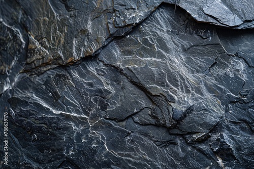 Dark grey black slate background or texture. Black stone surface with cracks. photo