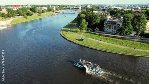 Vistula River, Wisla Seen From The Air In Cracow, Krakow, Poland, Polska. Flyover of Wisla Vistula River near the city centre of Crakow modern and historic architecture photo