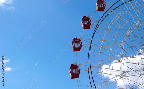 carousel ferris circle wheel over blue sky