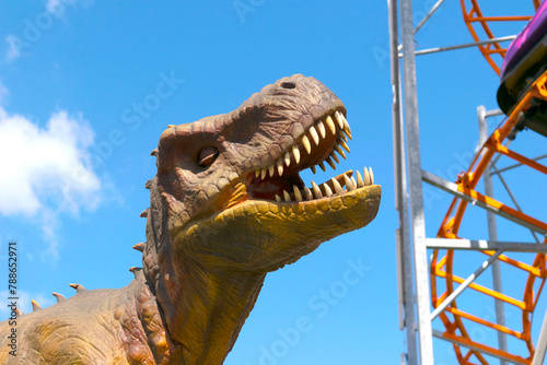 A large dinosaur statue attraction in park