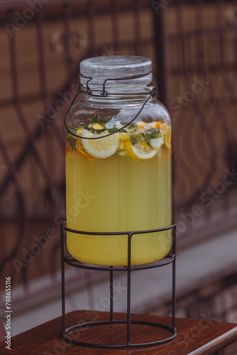 Non-alcoholic cocktail. Cool lemon drink. Lemonade in a jar. Street cafe. Quench your thirst. Summer drink. Glass jar with cold lemonade. 