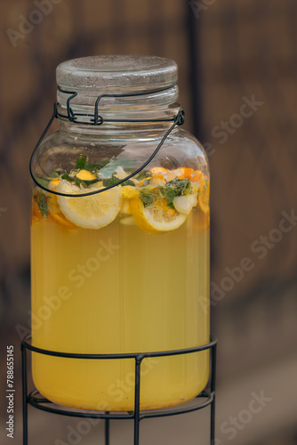 Non-alcoholic cocktail. Cool lemon drink. Lemonade in a jar. Street cafe. Quench your thirst. Summer drink. Glass jar with cold lemonade. 