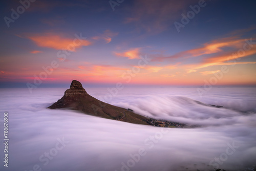 Aerial View of dramatic morning fog around Lion’s Head mountain during Blue Hour long exposure, Cape Town, South Africa. photo