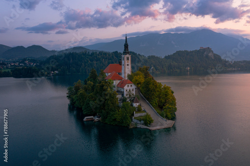 Aerial view of Sunrise at Lake Bled, with the church on Bled Island and the Julian Alps on backgrounds, Upper Carniolan, Slovenia. photo