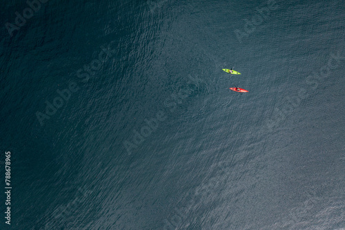 Aerial drone view of two kayakers heading out for a paddle on Lake Goerge, New York, United States. photo