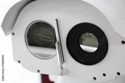 CCTV security camera lens closeup with wiper blade - big brother look