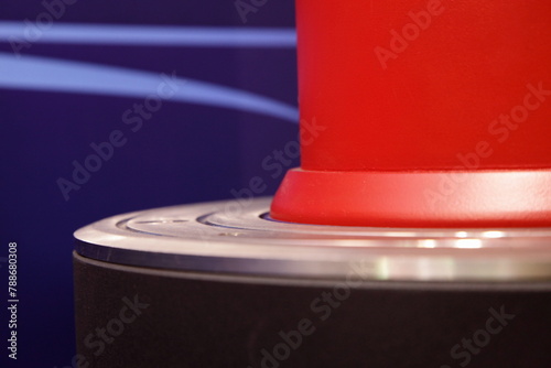 Modern hydraulic red traffic bollard cylinder base close-up