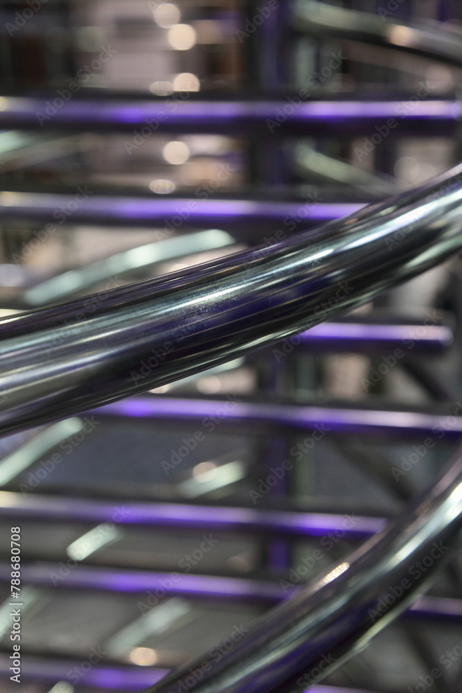 industrial abstract metal background with diagonal and horizontal chrome pipe lines