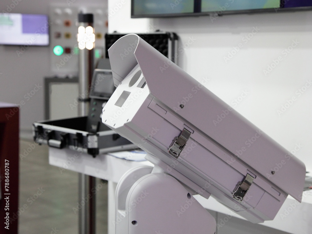 Portable CCTV security camera on case and security room background