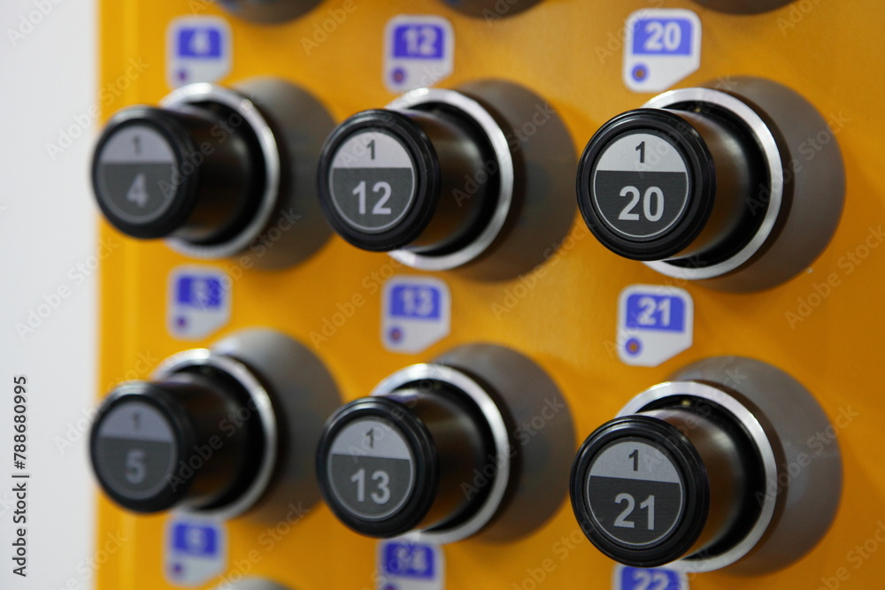 Key store knobs - industrial keys storage holder panel closeup