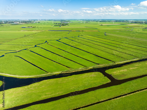 Aerial view of wide green meadows and ditches in peat meadow nature reserve De Wilck, Benthuizen, Netherlands. photo