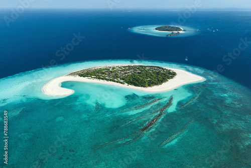 Aerial view of luxury resort on uninhabited island, Medhafushi, Maldives. photo