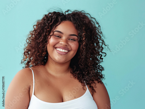 Portrait of African American woman smiling naturally on turquoise background. AI generative.