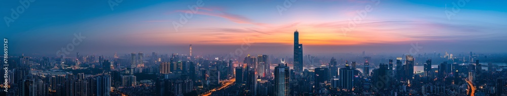 Panoramic Cityscape at Twilight with Landmark Tower Panoramic Cityscape at Twilight with Landmark Tower