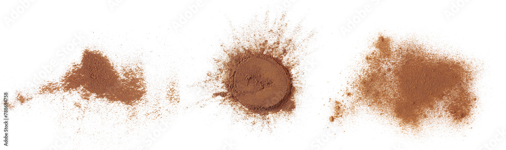 Set cinnamon powder scattered isolated on white, clipping path Set cinnamon powder scattered isolated on white, clipping path