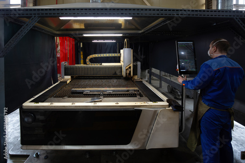 Laser cutting machine with CNC is cutting the steel sheet