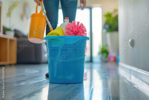 Blue bucket and different cleaning products photo